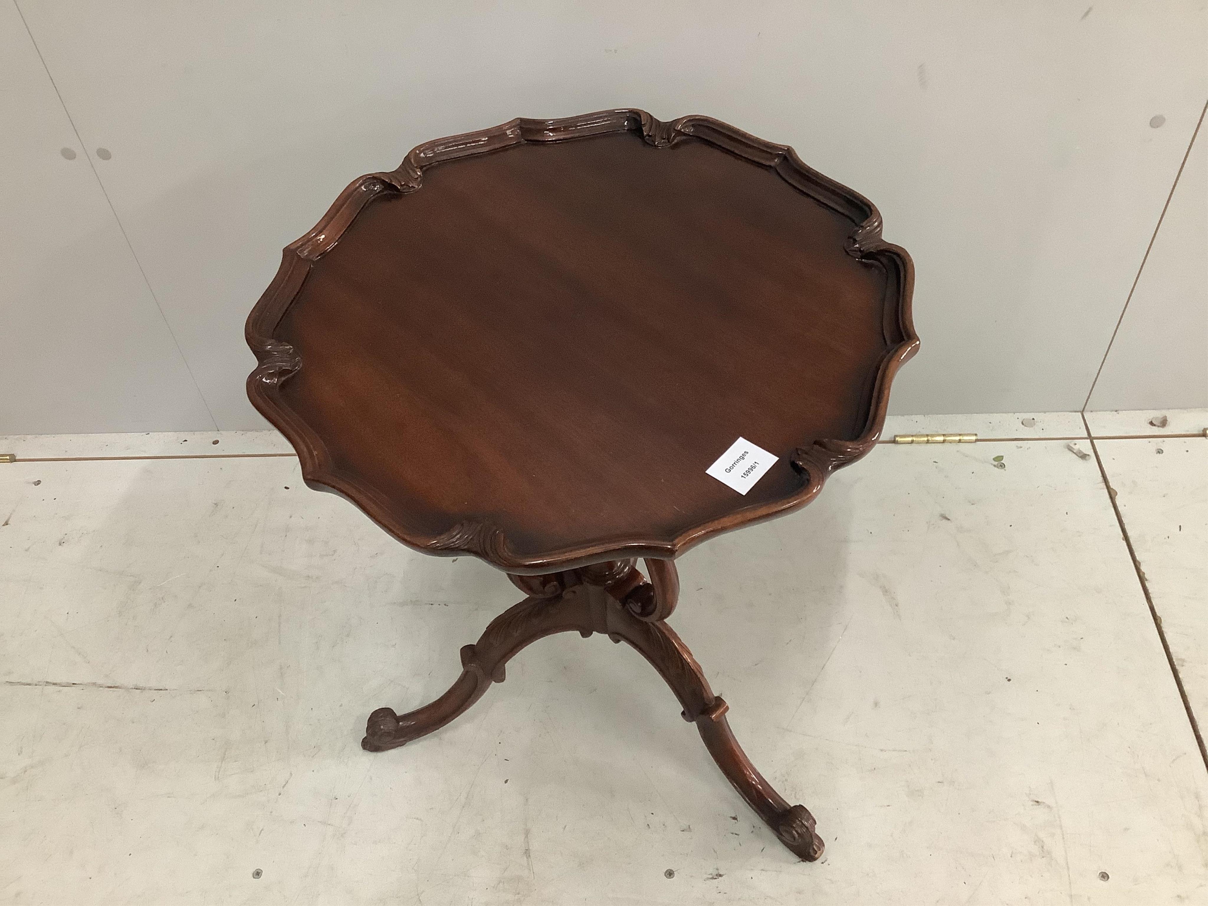 A George III style mahogany tripod wine table, by Henderson, diameter 50cm, height 60cm. Condition - good